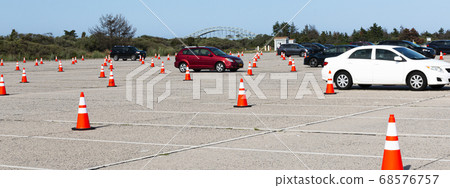 Beach parking lot with orange construction cones Beach parking lot with orange construction cones 68576757