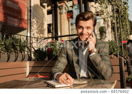 businessman working at the table in open coffee businessman working at the table in open coffee 68576802