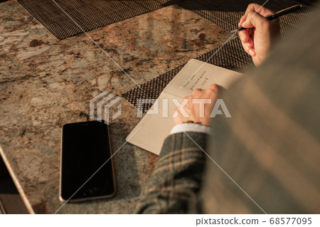 close-up. businessman working at the table in open coffee 68577095
