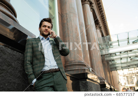 business man calls on the phone business man calls on the phone 68577157