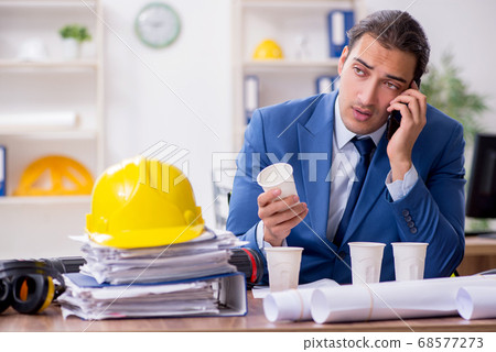 Young male architect working in the office 68577273