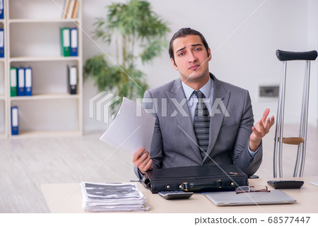 Young male employee after accident at workplace Young male employee after accident at workplace 68577447