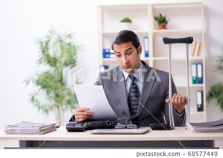 Young male employee after accident at workplace Young male employee after accident at workplace 68577449