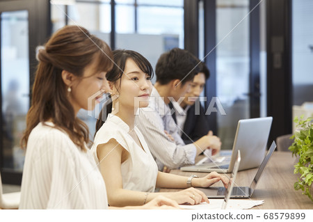 People working in coworking space 68579899