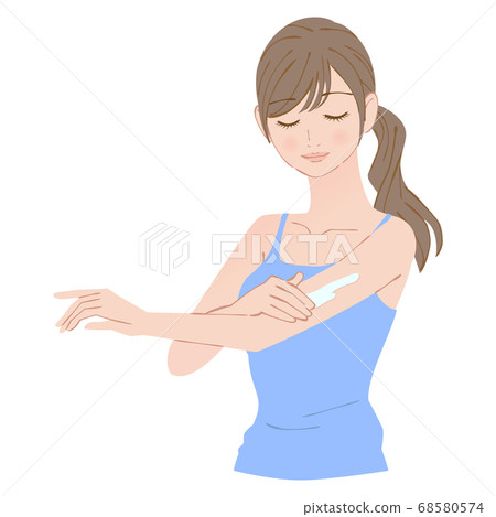 Woman applying sunscreen on her arm 68580574