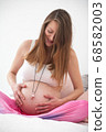 Pregnant woman concentrating on the baby 68582003