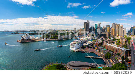 Sydney harbor bay and Sydney downtown skyline with opera house in a beautiful afternoon, Sydney, Australia. Sydney harbor bay and Sydney downtown skyline with opera house in a beautiful afternoon, Sydney, Australia. 68582029