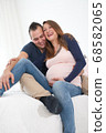 smiling pregnant couple 68582065