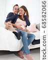 happy young pregnant couple 68582066