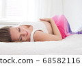 Relaxing pregnant woman 68582116