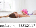 pregnant woman in her bedroom 68582117