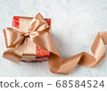 Christmas gift, red box with a golden bow, can also be used as a gift for St. Valentine's Day and birthday 68584524