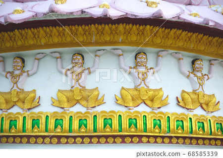 Buddhist deities pattern on temple white wall 68585339
