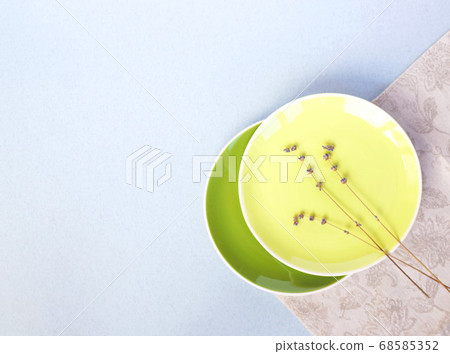 green and yellow plates on a white background. rustic style 68585352