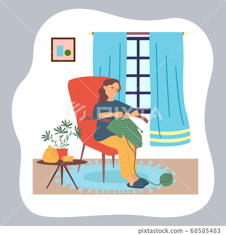 Woman knitting sitting at chair near window, hobby and leisure, quarantine isolation at home 68585483