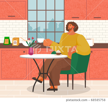 Stylish man sitting on modern armchair at home at a cozy table drinking coffee in a kitchen interior 68585758