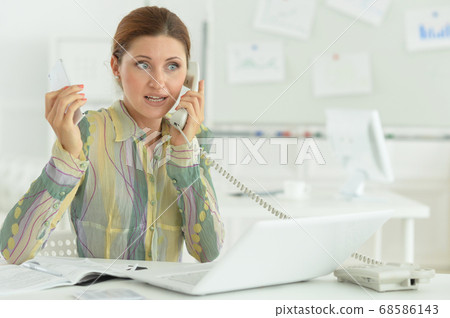 Portrait of a beautiful young woman working Portrait of a beautiful young woman working 68586143