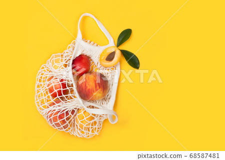 peaches and apricots in eco bag with copy space peaches and apricots in eco bag with copy space 68587481