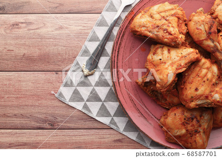 Grilled chicken fillets on plate. top down. Grilled chicken fillets on plate. top down. 68587701