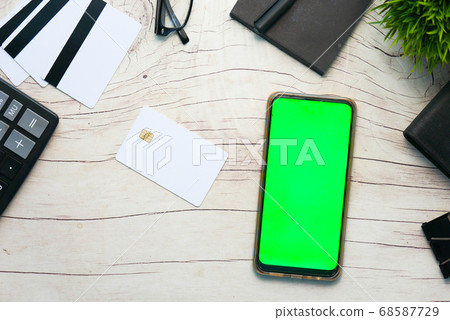 smart phone and credit card on wooden table, Top view smart phone and credit card on wooden table, Top view 68587729