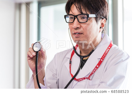 Doctor examining with a stethoscope Doctor examining with a stethoscope 68588523