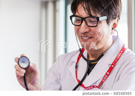 Doctor examining with a stethoscope Doctor examining with a stethoscope 68588565