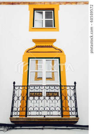 white and yellow house in Evora, Portugal 68589572