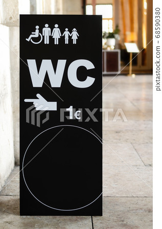 Wc on payment sign in the streets with empty round Wc on payment sign in the streets with empty round 68590380
