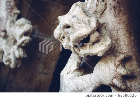 ancient dragon sculpture on a castle portal ancient dragon sculpture on a castle portal 68590526