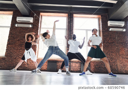 Happy modern ballet improvising together in studio 68590746