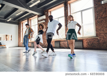 Cheerful young people during aerobics workout indoors 68590808