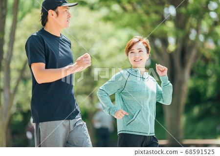 Men and women walking Men and women walking 68591525