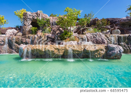 landscape of beautiful Artificial waterfall in garden at the public park landscape of beautiful Artificial waterfall in garden at the public park 68595475
