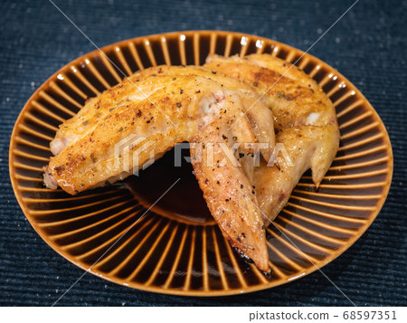 Chicken wings roasted on the grill. Chicken wings roasted on the grill. 68597351