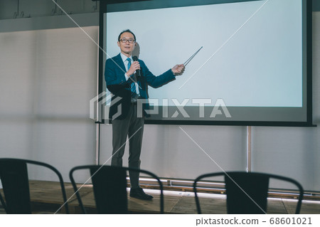 Business presentation Male in fifties Business presentation Male in fifties 68601021