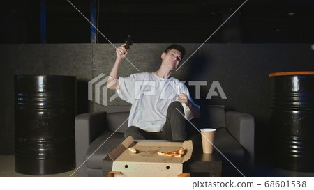 Funny excited man gamer playing videogame celebrating victory Funny excited man gamer playing videogame celebrating victory 68601538