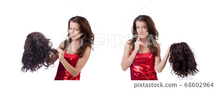 Woman with a selection of wig isolated on white Woman with a selection of wig isolated on white 68602964
