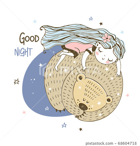 A cute little girl is sleeping sweetly on a big 68604718