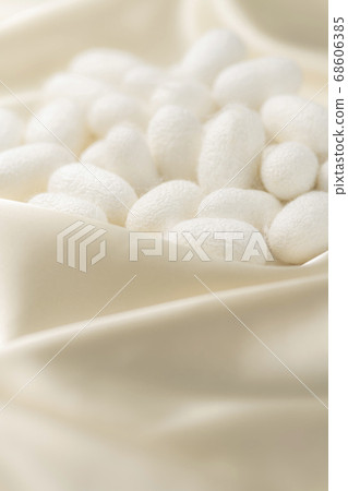 Cocoon ball and silk background Cocoon ball and silk background 68606385