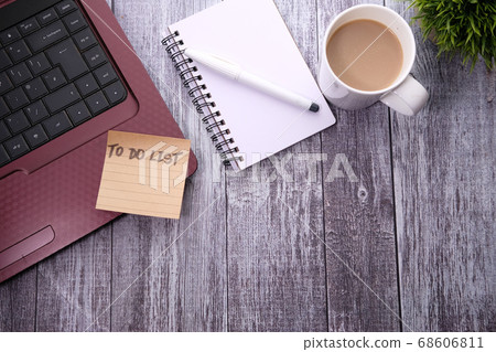 Coffee cup, laptop and notebook with to do list Coffee cup, laptop and notebook with to do list 68606811