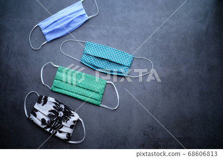 Homemade cotton Face Mask for preventing virus on gray background Homemade cotton Face Mask for preventing virus on gray background 68606813