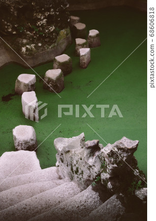 stone path to cross a water pond stone path to cross a water pond 68606818