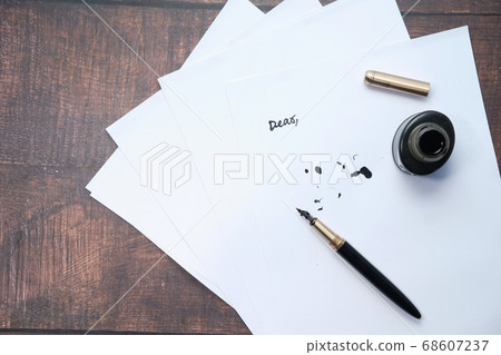 empty paper with fountain pen on gray background  68607237