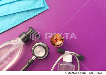 surgical face mask, pills and hand sanitizer with copy space  68608602
