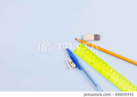 Office supplies on a light blue background. Office supplies on a light blue background. 68609342