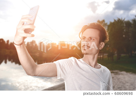 portrait of Young handsome stylish smiling guy 68609698