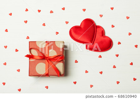A gift in a box on a wooden background A gift in a box on a wooden background 68610940