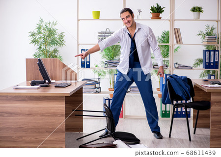 Young male employee businessman at workplace Young male employee businessman at workplace 68611439