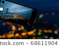 Night view of Hakodate through smartphone 68611904