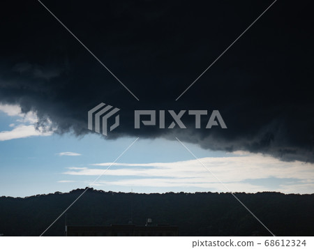 Image of guerrilla heavy rain sky Boundary of clear blue sky and rain clouds in midsummer Image of guerrilla heavy rain sky Boundary of clear blue sky and rain clouds in midsummer 68612324